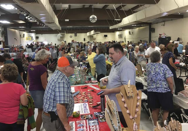 Crowds browsing tables at a Quartzsite gem and mineral show