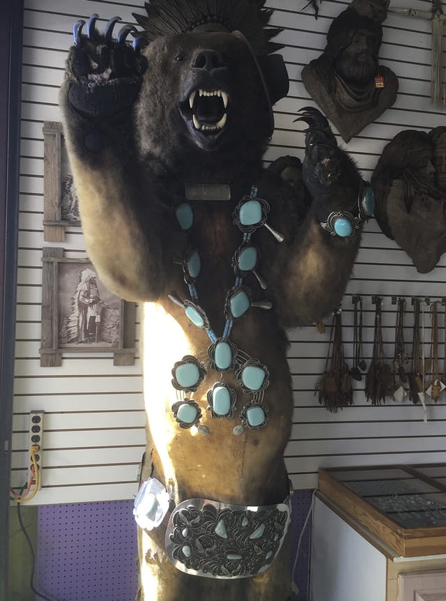 Turquoise squash-blossom necklace and Western keepsakes on display