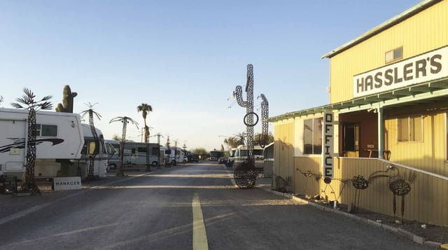 The park's main road lined with RVs, palm trees and the Hassler's office
