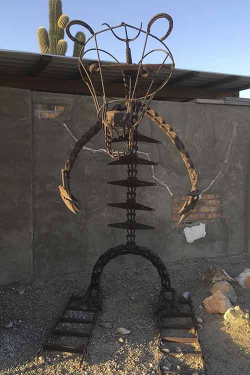 Scorpion sculpture welded from horseshoes and chain